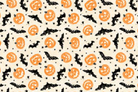Halloween-themed pattern with pumpkins, bats, and stars on a beige background