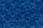 Close-up of blue textured fabric with circular patterns