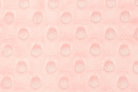 Pattern of small circles on a pink background