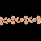 Decorative lace trim with floral patterns on a black background