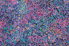 Multicolored confetti pattern on a textured surface