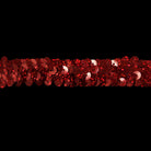 Red sequin strip on a gray background